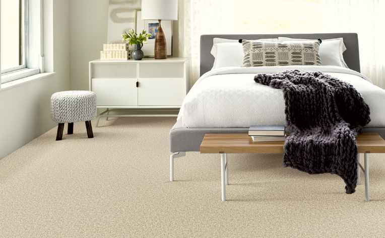 plush cut pile carpet in cozy bedroom with throw